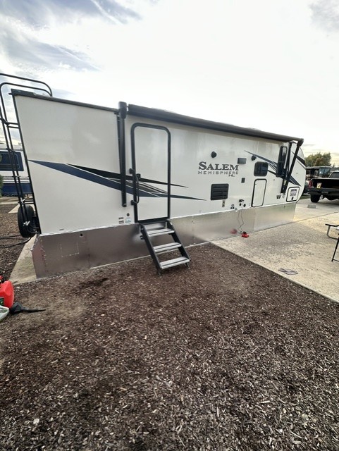 Completed skirting installation along the side of a travel trailer